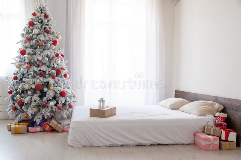 White Christmas tree with red bedroom toys new year winter gifts decor royalty free stock photography White Christmas tree with red bedroom toys new year winter gifts decor royalty free stock photography