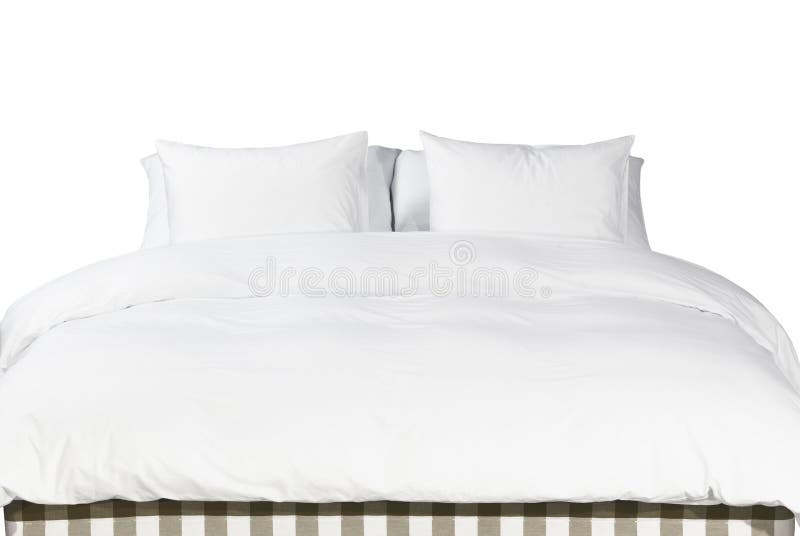 White pillows and blanket on a bed royalty free stock image