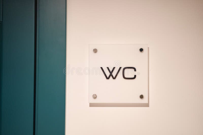 White WC sign at the entrance to the toilet. Interior Design stock photos White WC sign at the entrance to the toilet. Interior Design stock photos