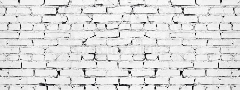 Wide white brick wall texture. Aged rough whitewashed brickwork. Grunge background royalty free stock photos