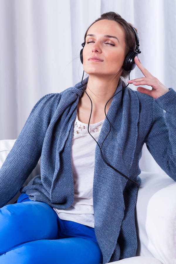 Woman listening to music stock photography