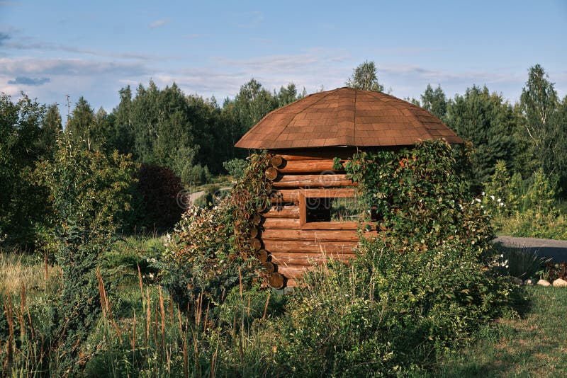 Wooden gazebo in summer park royalty free stock photography