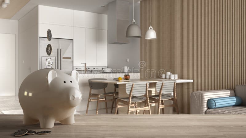 Wooden table top or shelf with white piggy bank with coins, modern white kitchen and dining room, expensive home interior design,. Renovation restructuring stock image