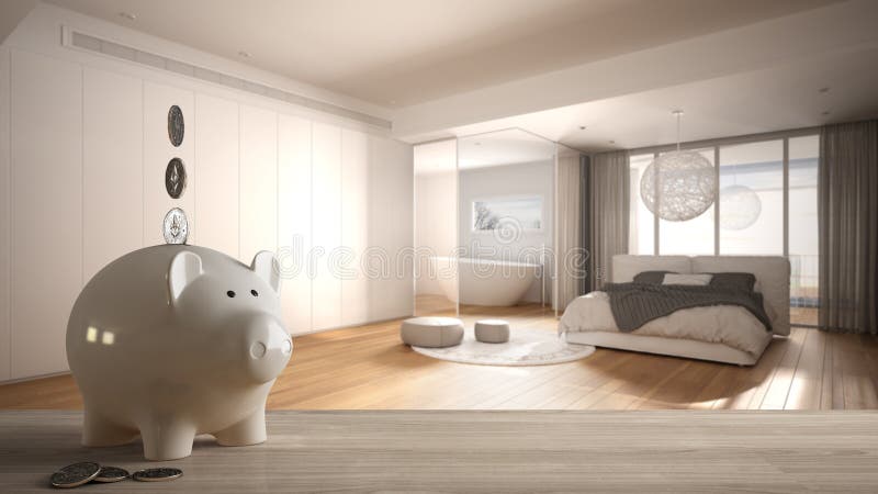 Wooden table top or shelf with white piggy bank with coins, modern panoramic bedroom with bathroom, expensive home interior design. Renovation restructuring stock photo