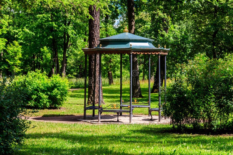 Wrought iron gazebo in park at summer stock photography