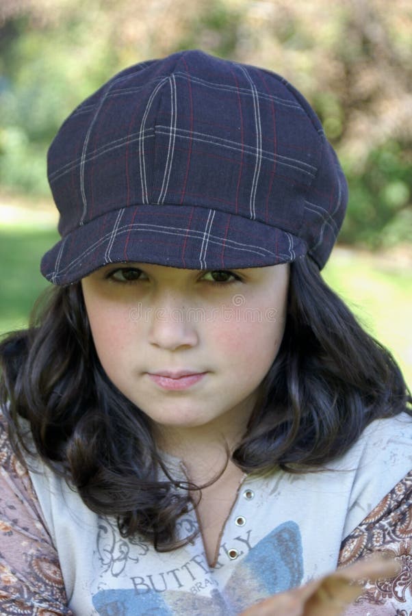 Young girl wearing a hat stock image