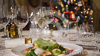 Restaurant concept. New Year and Merry Christmas feast table. Waiter in gloves putting napkin on table in background stock video
