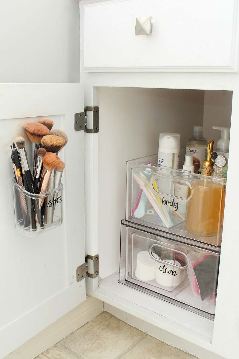 Bathroom cabinet acrylic organizers and make-up brush holder.