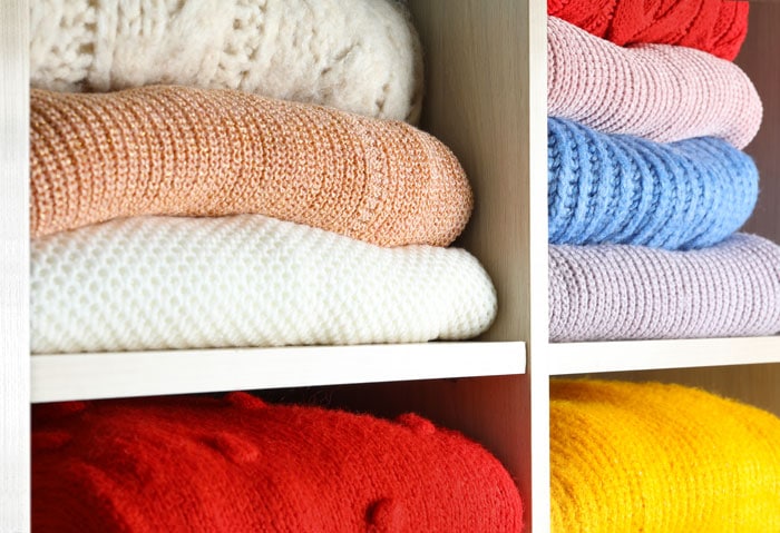 cubbies filled with folded sweaters
